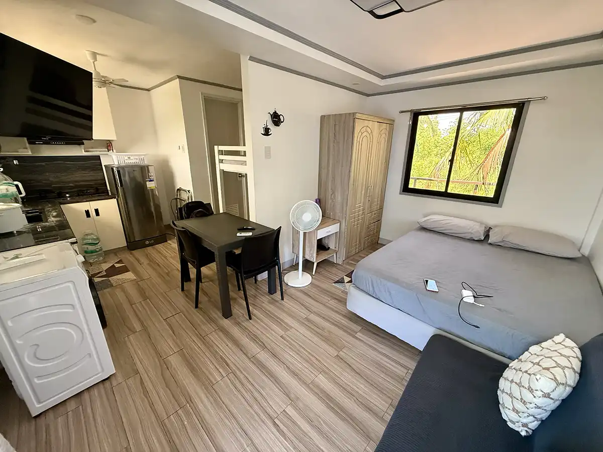 Cozy guesthouse room with kitchen and dining area at Mangrove Sunshine, Olango Island